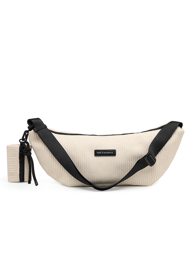 Cream ribbed crescent shoulder bag with an adjustable black strap and matching small zip pouch.