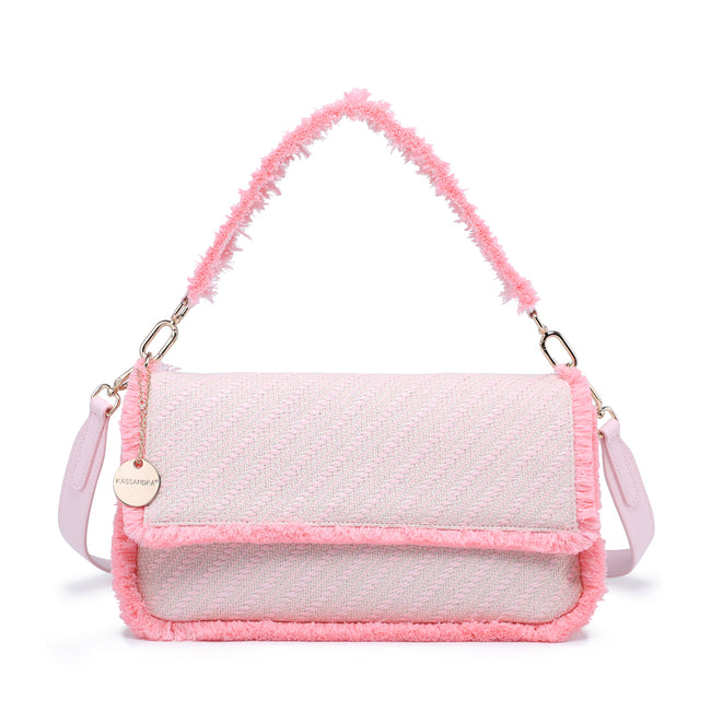 Pink textured flap shoulder bag with fringed edges, a matching handle and a round charm.