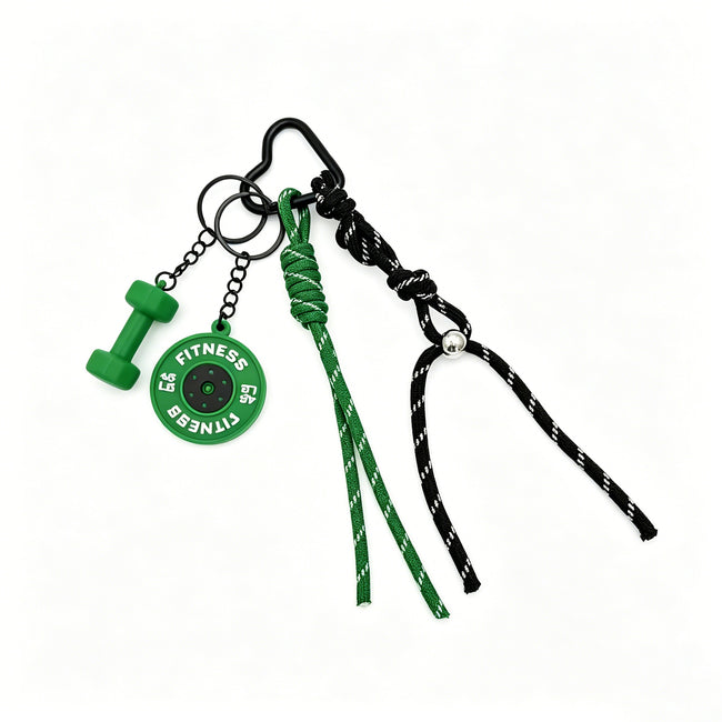 Green fitness-themed keyring with miniature dumbbell and weight-plate charms and knotted cords.