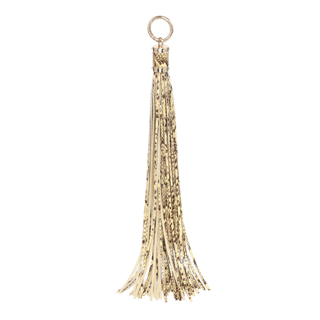 Gold-toned speckled tassel charm with long strands and a round metal ring