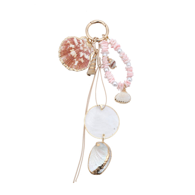 Keyring with a pink beaded loop, mottled scallop shell, pale round pendant and dangling shell charms.