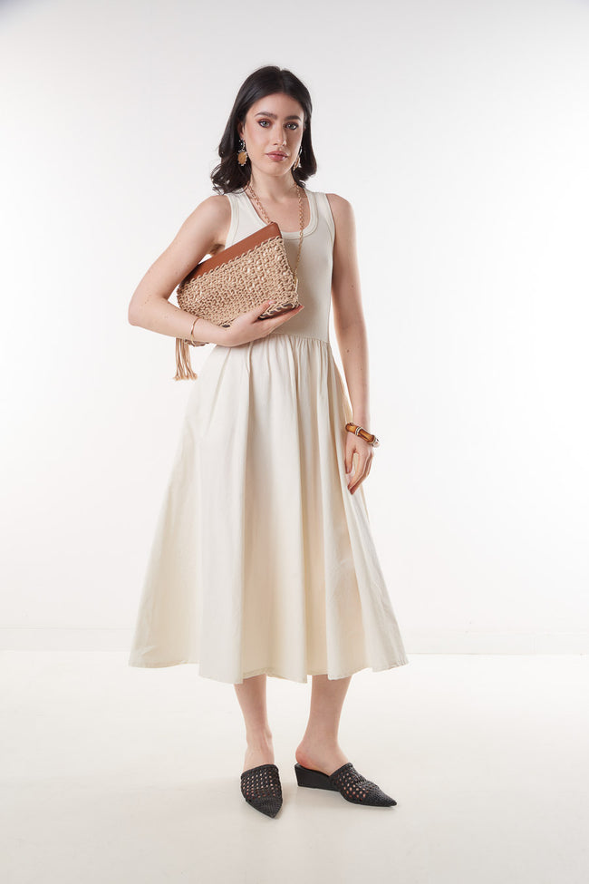 White cream sleeveless cotton midi dress with ribbed fitted upper, round neckline, gathered waist and flowing skirt