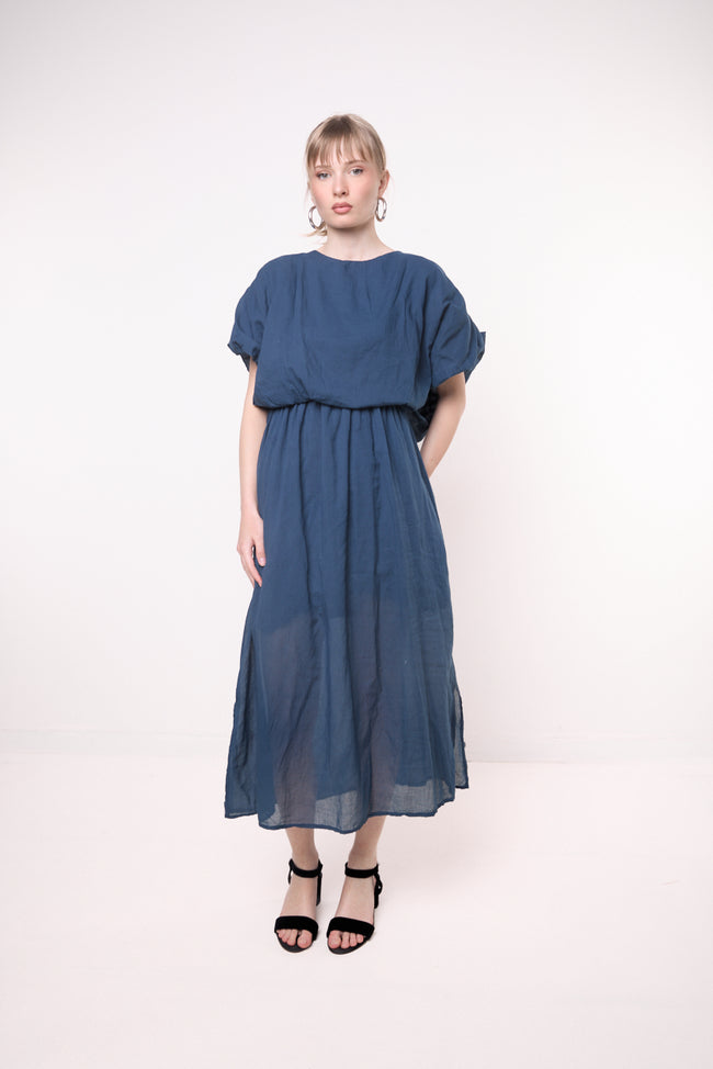 Dark blue semi-sheer cotton midi dress with relaxed blouson bodice, wide gathered short sleeves and elastic waist