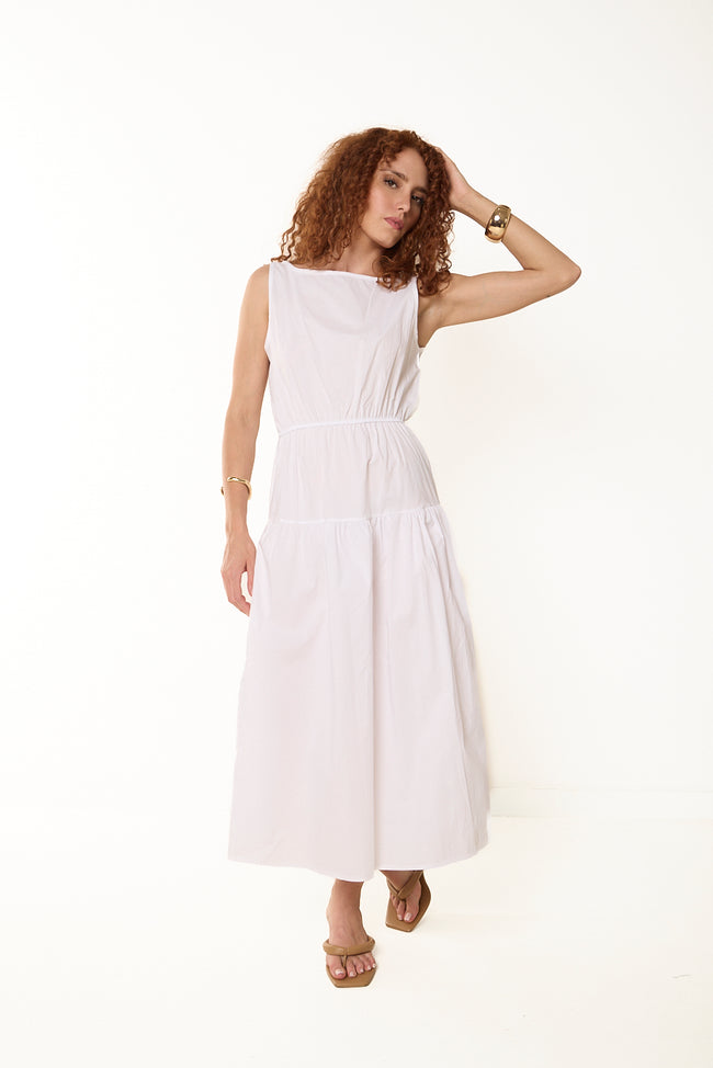 White sleeveless cotton midi dress with boat neckline, elasticated gathered waist and gathered skirt tiers