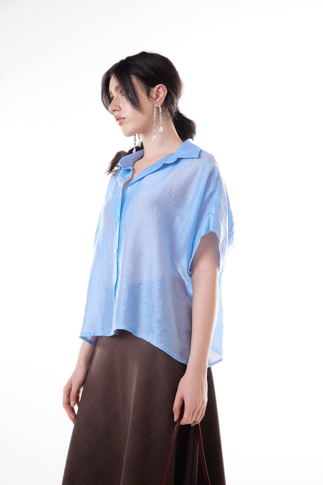 Light blue short-sleeve relaxed lyocell-blend shirt with pointed collar, button front and folded sleeve finish, side view