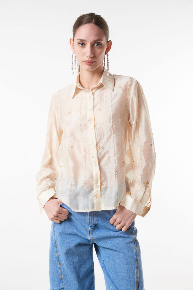 Cream sheer floral-embroidered button-front shirt with pointed collar and long cuffed sleeves