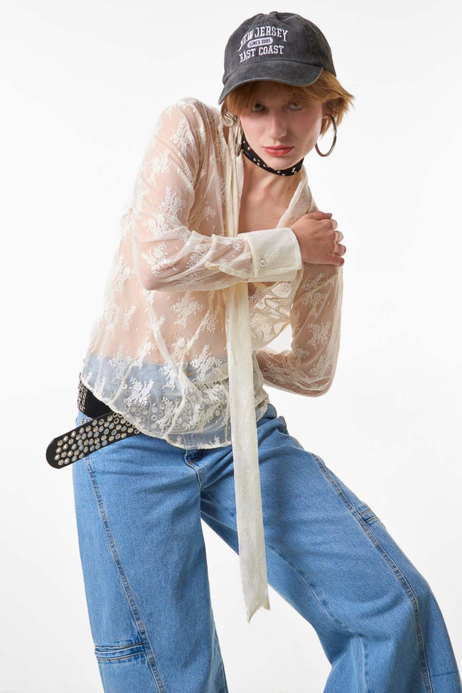 White sheer floral lace blouse with neck tie, front buttons and long cuffed sleeves