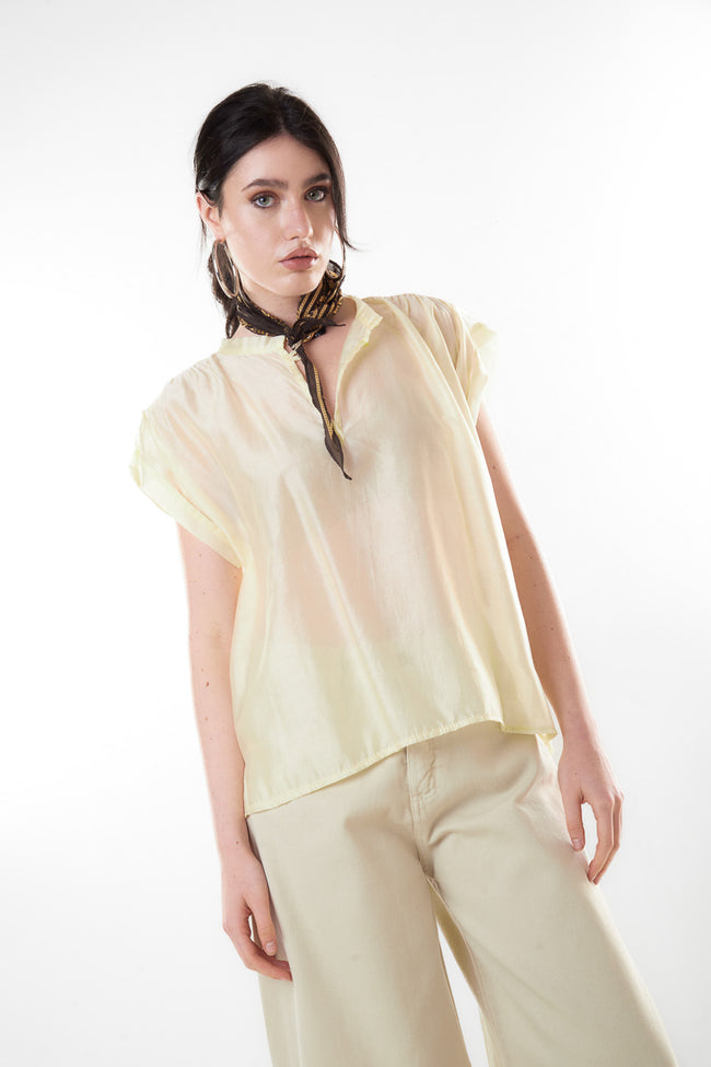 Light yellow sheer short-sleeve Tencel-blend blouse with mandarin collar, small V-slit neckline and relaxed fit