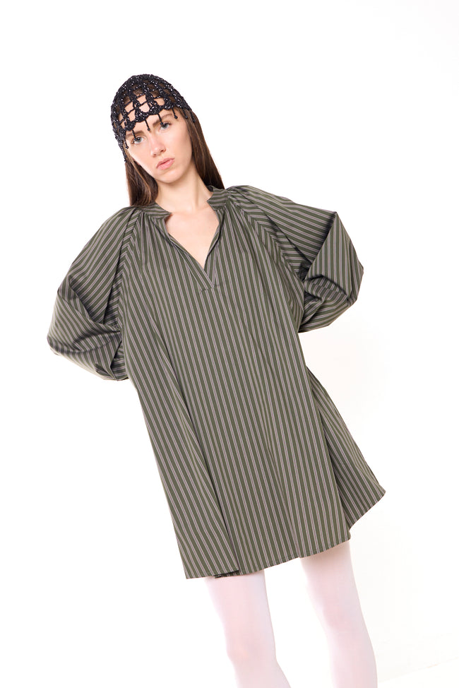 Olive green with dark stripes striped longline oversized blouse with open V-neckline, gathered neckline, long balloon sleeves and gathered elastic cuffs; belt, lace cap and tights styled separately