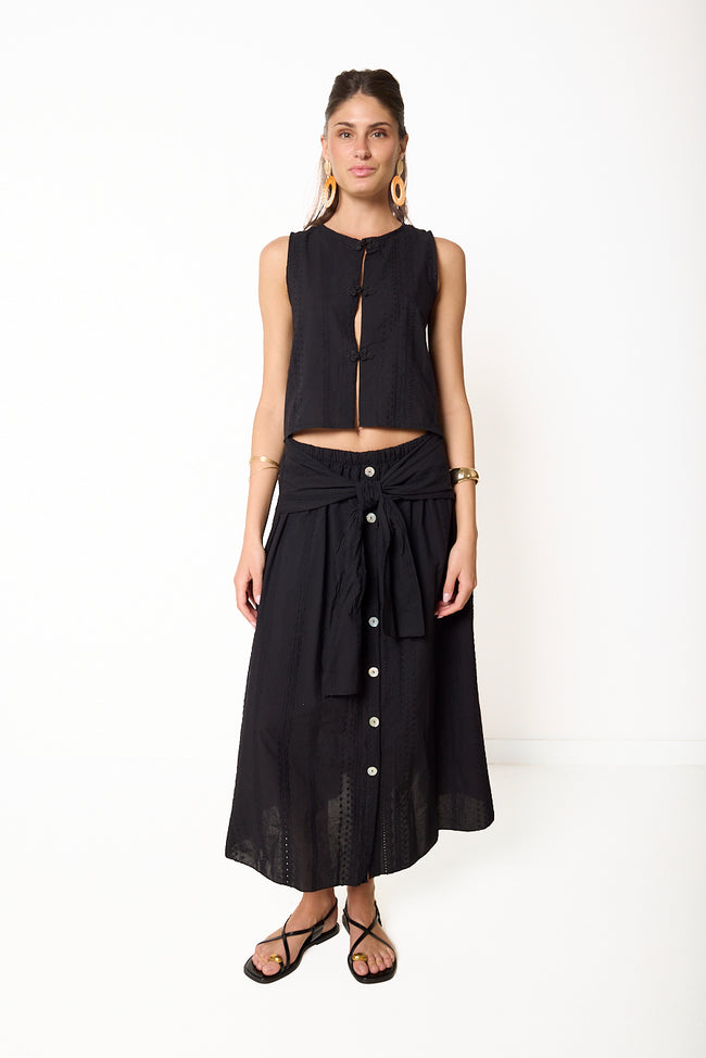 Black textured cotton midi skirt with decorative front buttons, elasticated waist and self-tie overlay; matching top styled separately