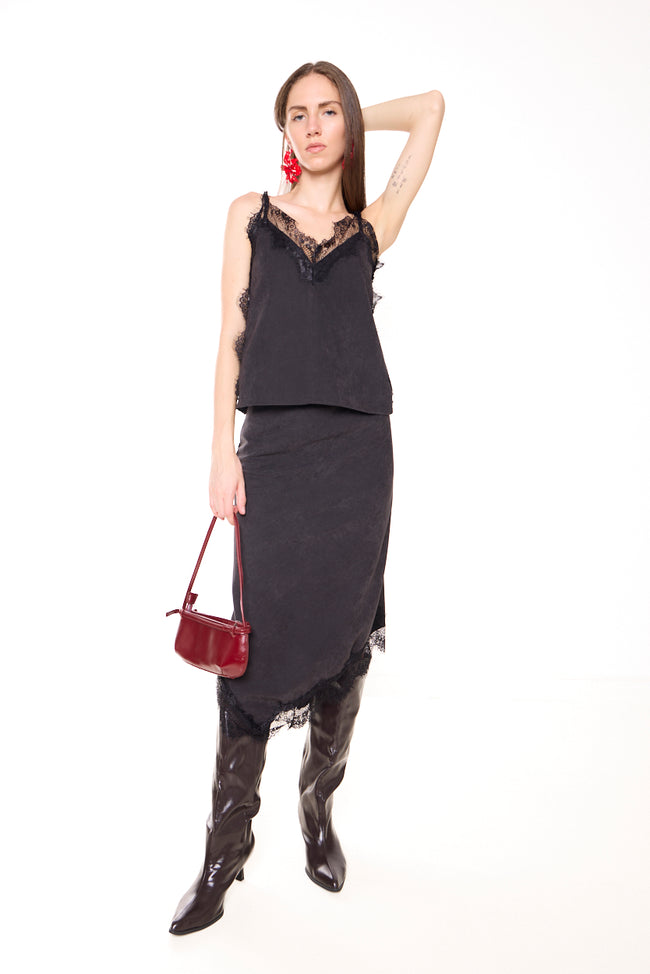 Black with black lace velvet-effect asymmetric midi skirt with fitted upper silhouette and eyelash lace hem trim; coordinating camisole, boots, earrings and bag styled separately