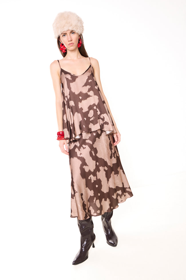 Coffee brown and muted pink abstract-print viscose satin-effect midi skirt with flared silhouette and asymmetric hem; matching camisole, hat and bracelets styled separately