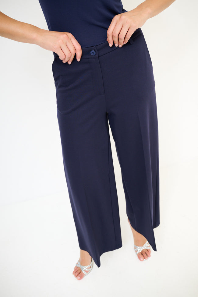 Navy blue tailored wide-leg culotte trousers with front hem slits