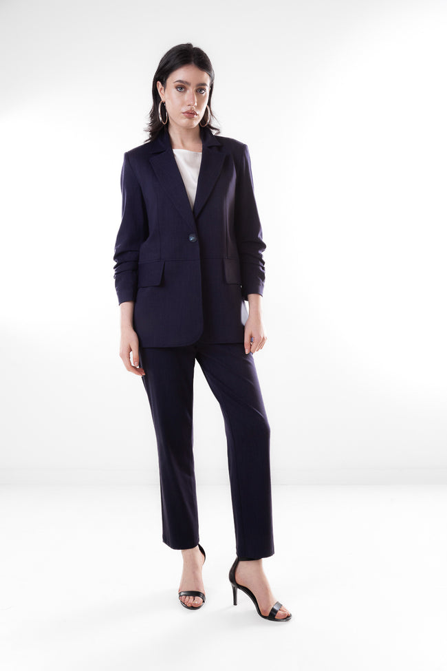 Dark blue straight-leg tailored ankle-length trousers with button-front waistband and side pockets