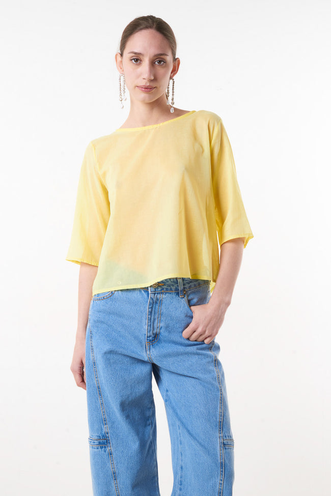 Yellow loose cotton blouse with wide round neckline and short sleeves, front view