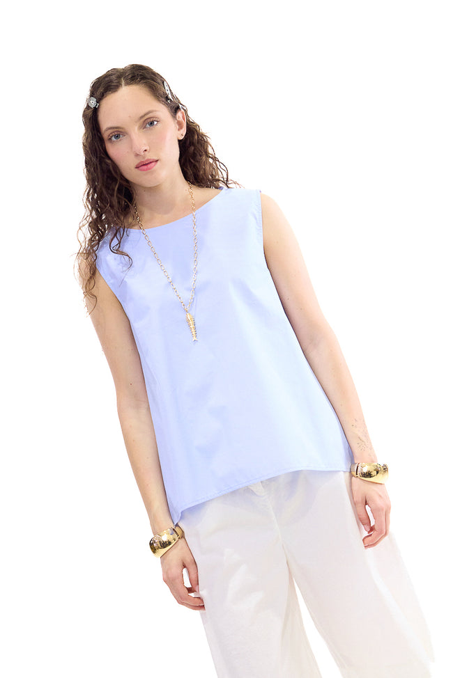 Light blue sleeveless cotton blouse with round front neckline, deep V back opening and overlapping asymmetric back panels
