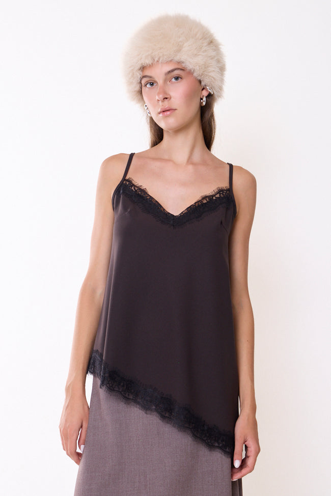 Coffee dark brown lace-trim V-neck camisole with narrow adjustable straps and lace edging at asymmetric lower hem; skirt and accessories styled separately