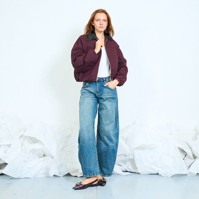 Bordeaux cropped zip-front bomber jacket with contrast faux-leather-look collar, long voluminous sleeves, gathered cuffs and hem and side pocket openings; plain top, jeans or skirt and shoes styled separately