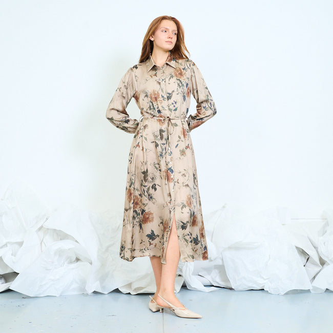 Beige taupe-ground floral-print shirt midi dress with pointed collar, front buttons, long sleeves and pictured waist tie; shoes styled separately