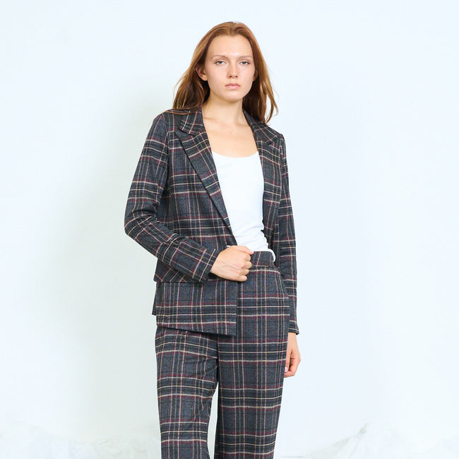 Black and grey checks checked blazer with notched lapels, front button fastening, front flap pockets and long sleeves; plain top, coordinating trousers and shoes styled separately