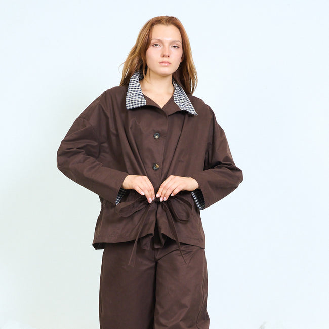 Coffee brown roomy button-front jacket with contrast checked collar, long voluminous sleeves and gathered waist with tie detail; coordinating trousers, skirt or dress and shoes styled separately