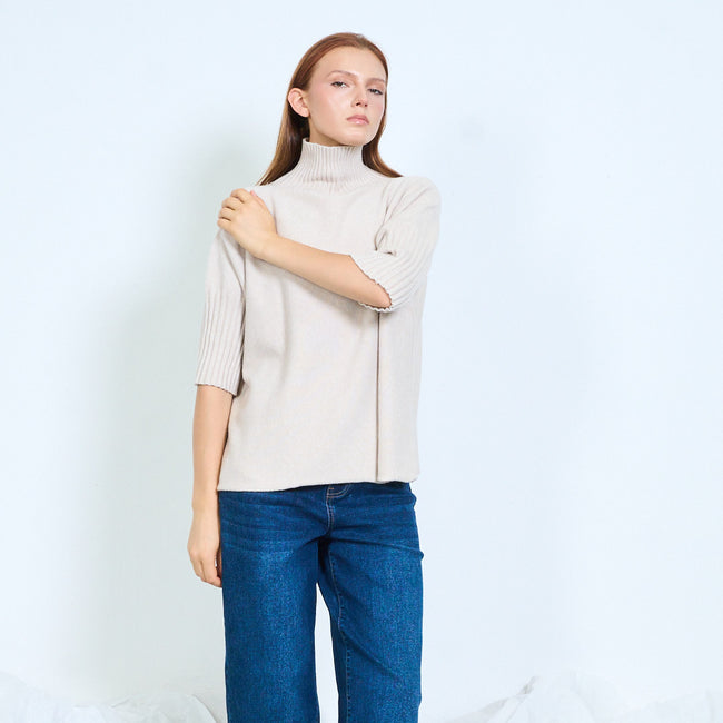 Beige high-neck sweater with ribbed elbow-length sleeves, front view.