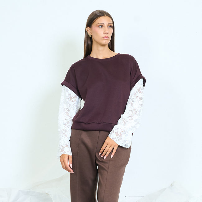 Burgundy round-neck top with white floral lace sleeves.