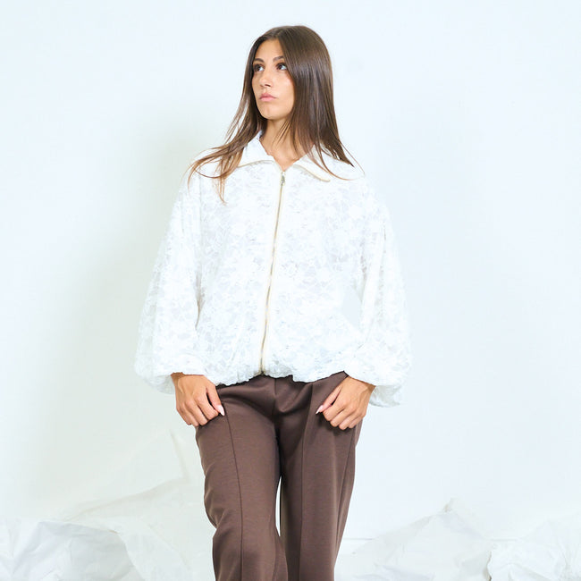 White floral lace zip jacket with a pointed collar and wide sleeves.