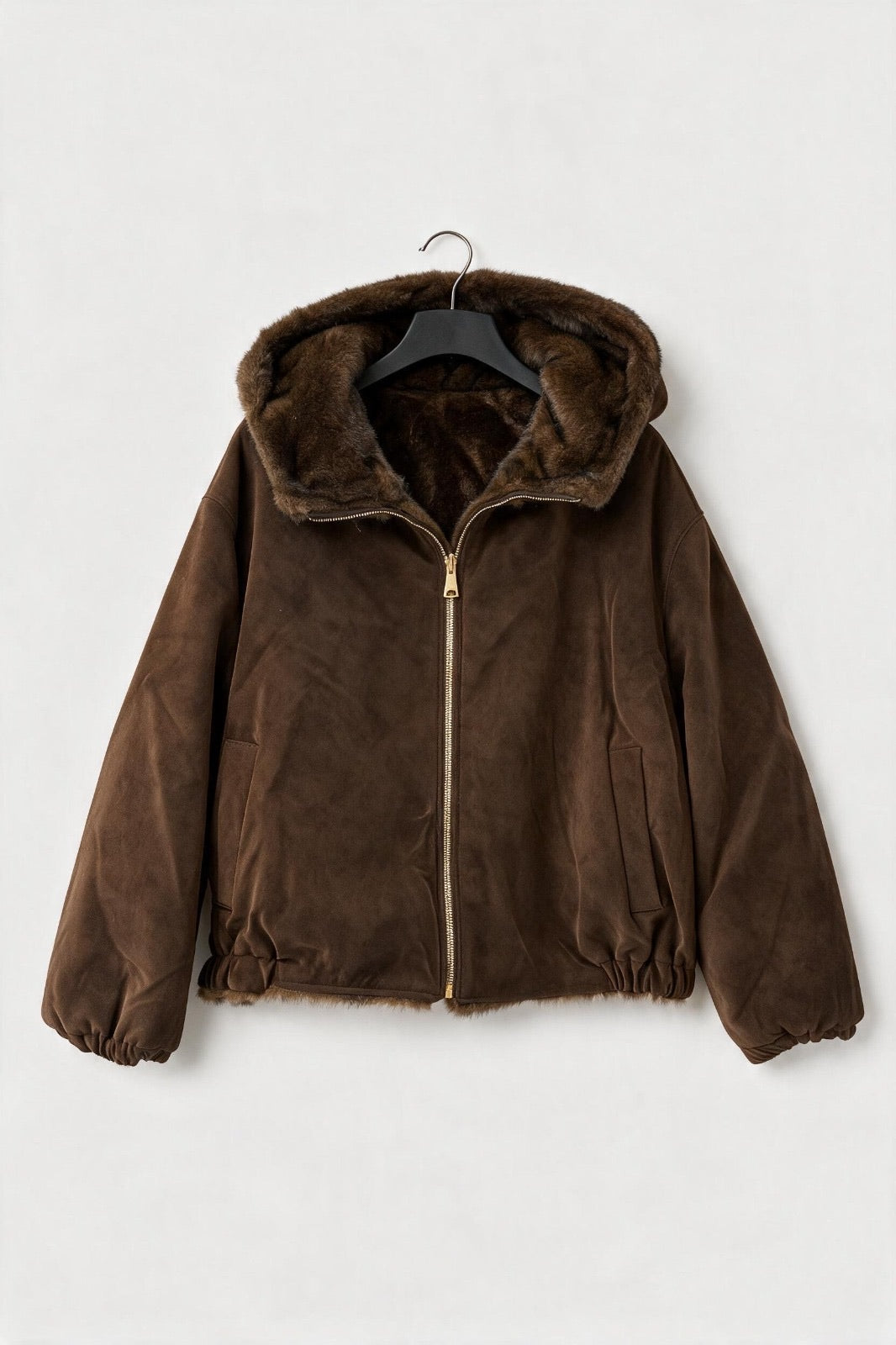 Brown hooded faux-suede jacket with plush faux-fur lining and a front zip, shown on a hanger