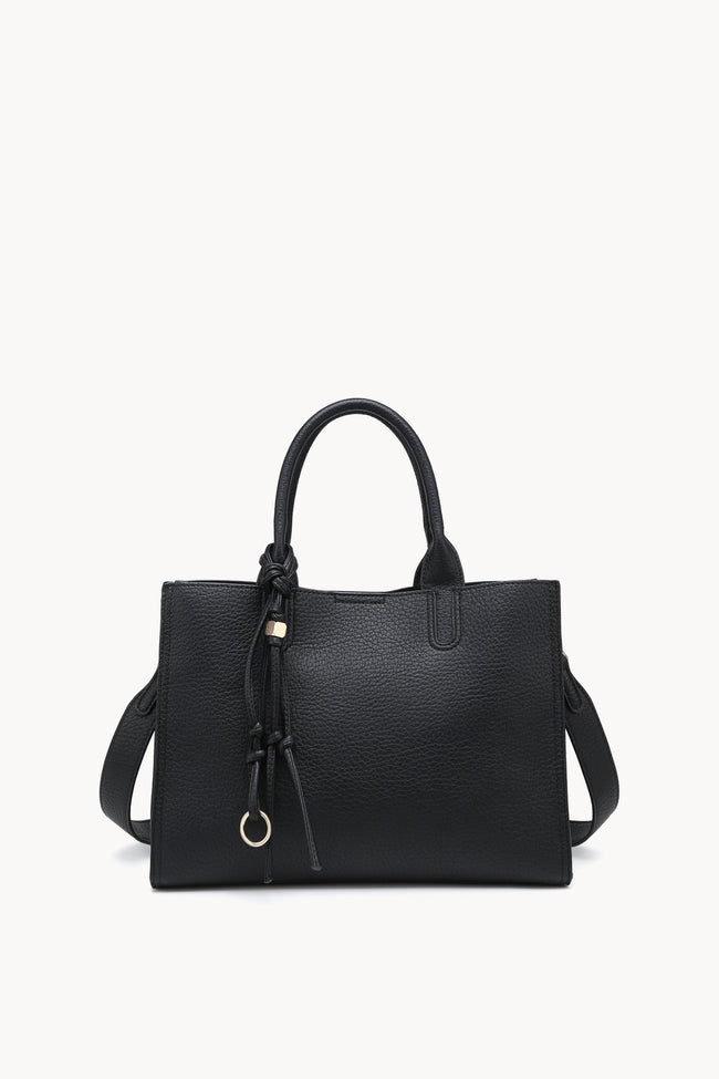 Black rectangular handbag with twin handles, shoulder strap and knotted ring charm.