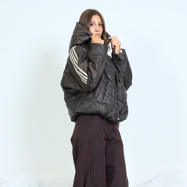 Dark brown hooded quilted jacket with contrast stripes on the sleeves.