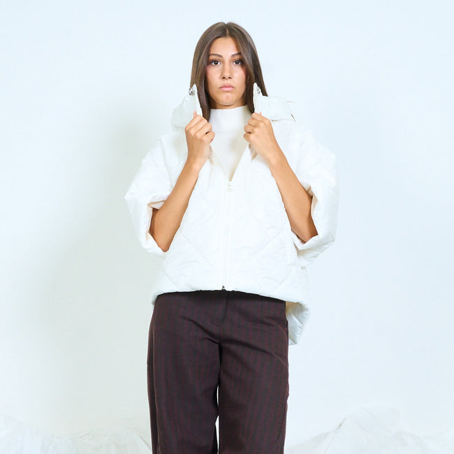 White hooded quilted jacket with wide short sleeves.