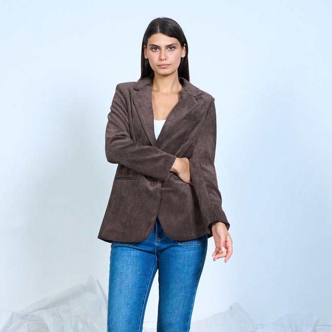 Brown corduroy-textured blazer shown with one sleeve held across the waist